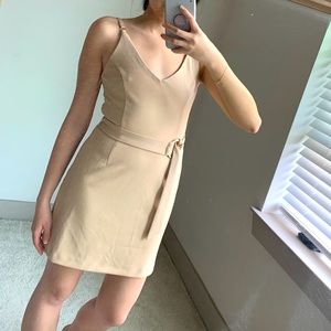 Beige cocktail dress with gold belt